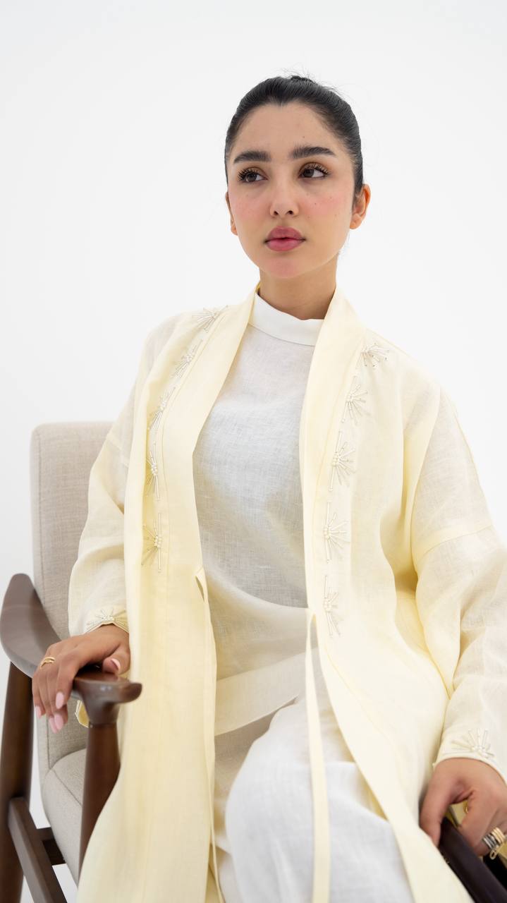 Yellow linen abaya with hand-stitched details (1919)