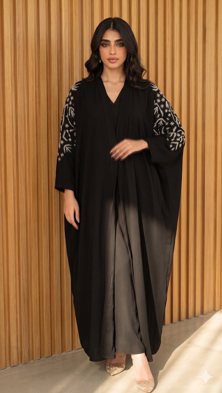 Black crepe abaya with silver hand-beaded details.