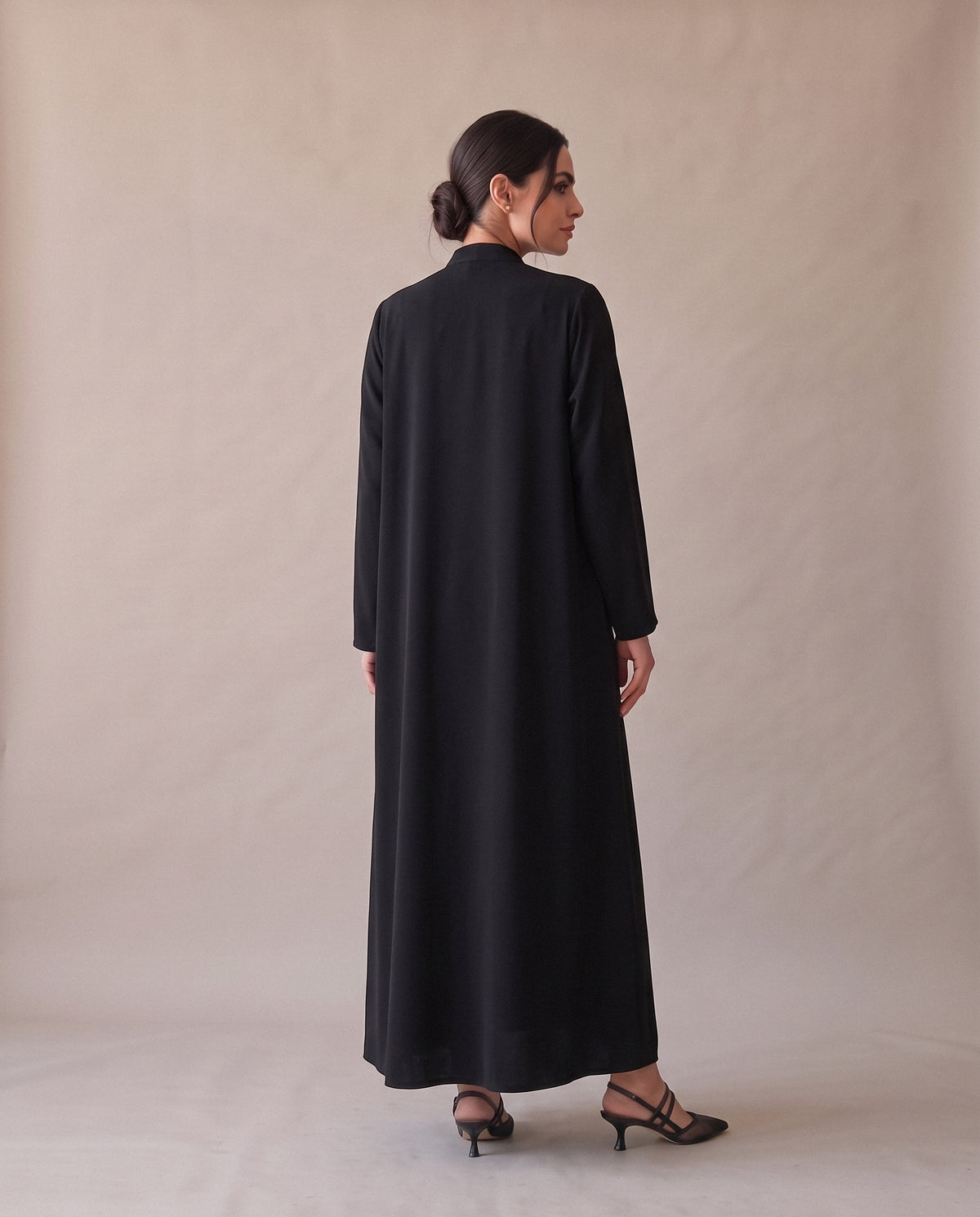 The Black Abaya with Brown & Beige Blocks from the back: plain black.