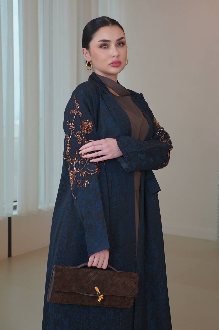 A navy blue jacquard silk blazer abaya with hand-stitched details.C:6754