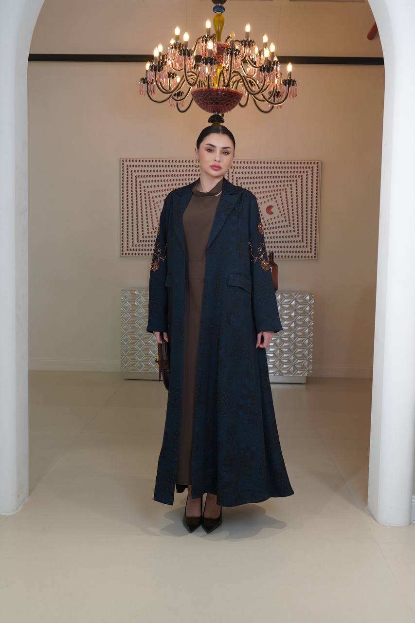 A navy blue jacquard silk blazer abaya with hand-stitched details.C:6754