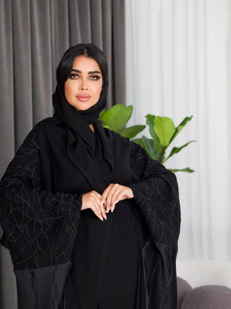 Free size crepe abaya with black embroidery and pleats on the back