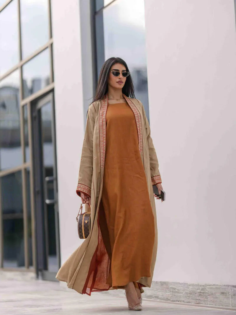 Beige linen abaya with embroidery and embroidery on the sleeves and collar
