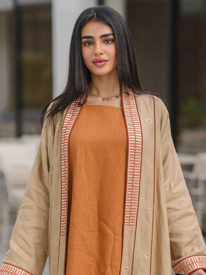 Beige linen abaya with embroidery and embroidery on the sleeves and collar