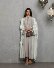 Off-white and beige  linen abaya with embroidery on the sleeves
