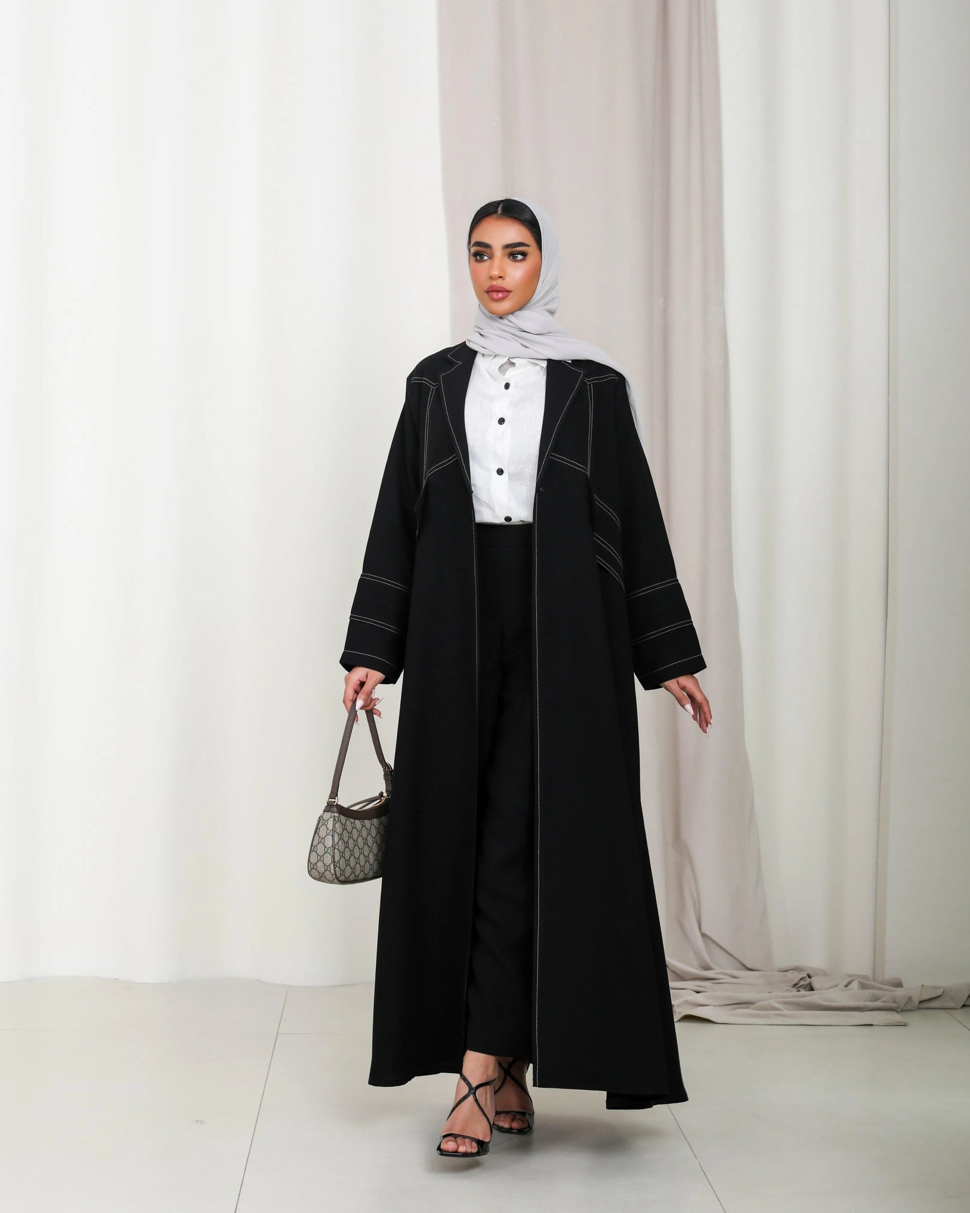 Black crepe abaya with beige stripes in the front