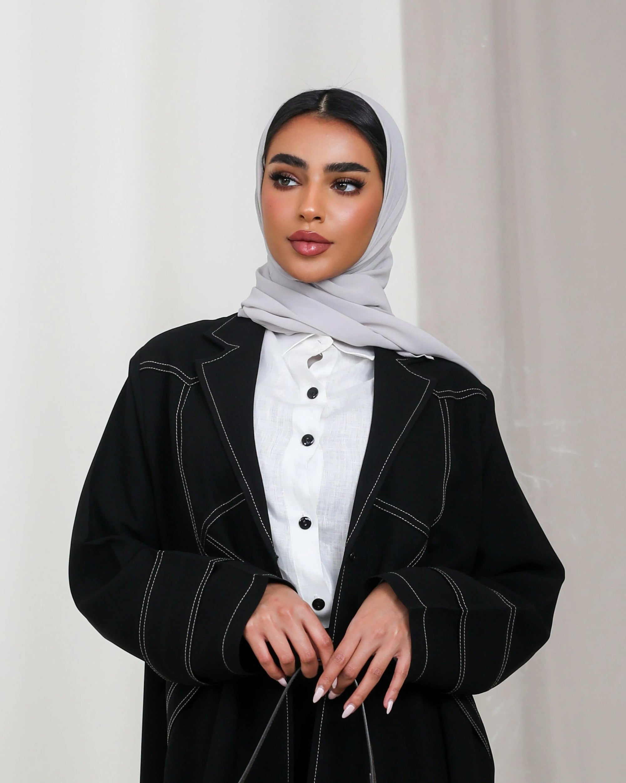 Black crepe abaya with beige stripes in the front