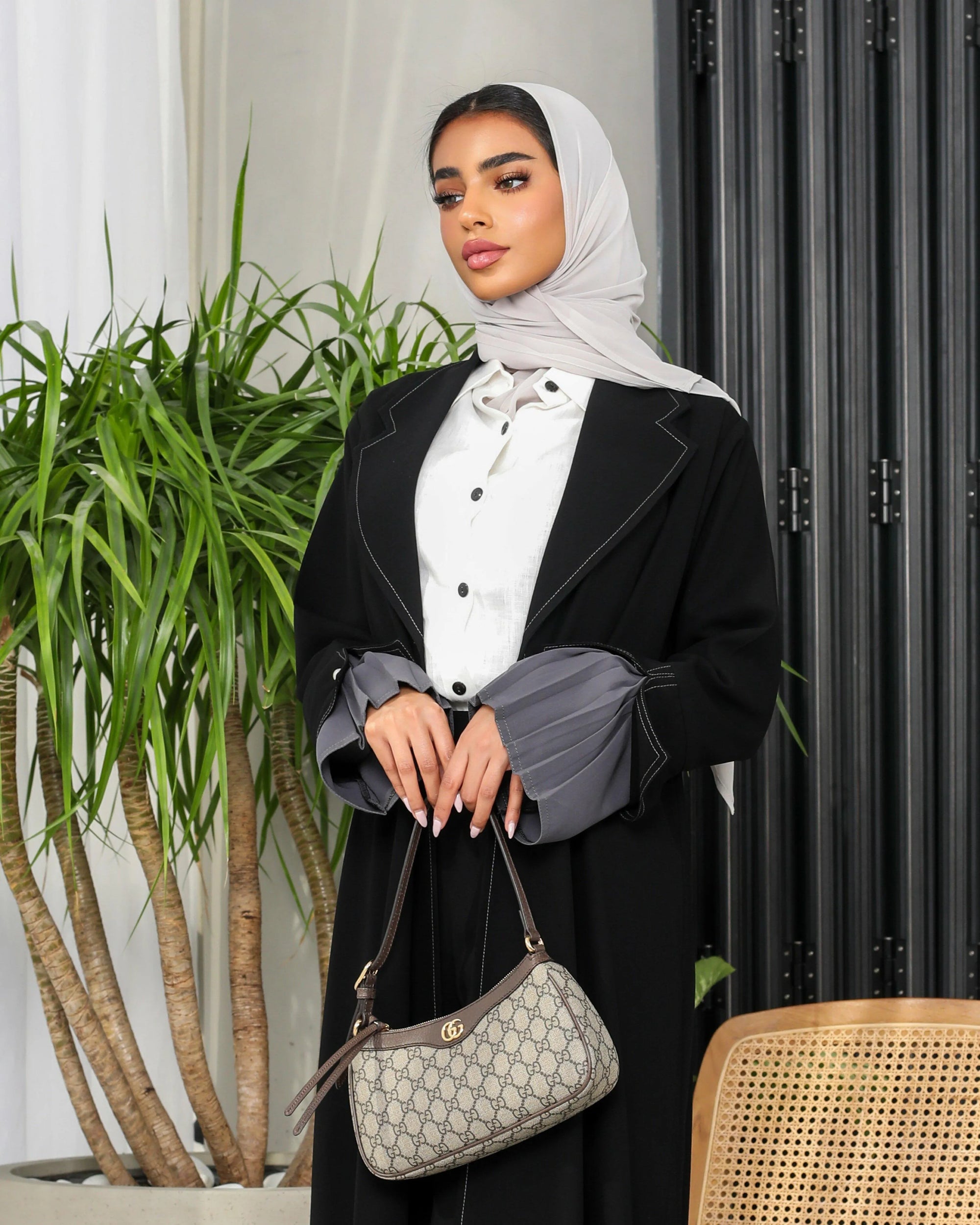 Black crepe blazer with grey on the sleeves and cloche at the back