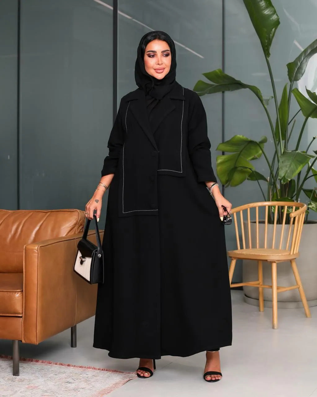 Black crepe blazer abaya with white stitching on the front