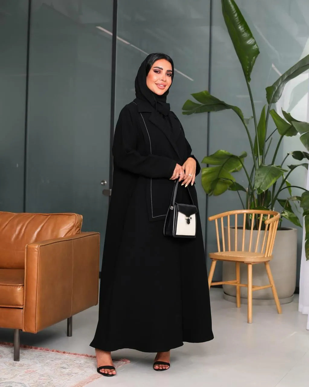 Black crepe blazer abaya with white stitching on the front
