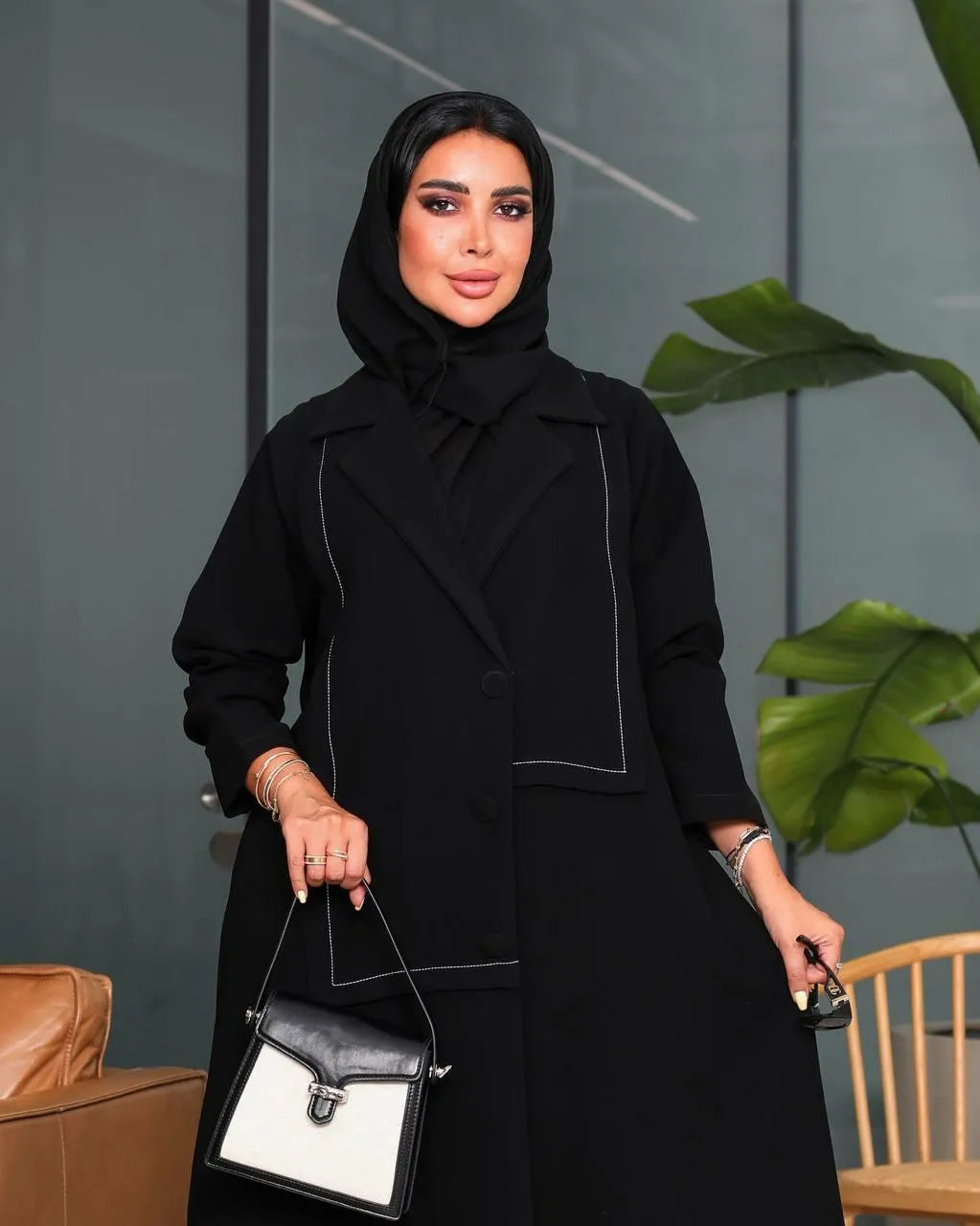 Black crepe blazer abaya with white stitching on the front