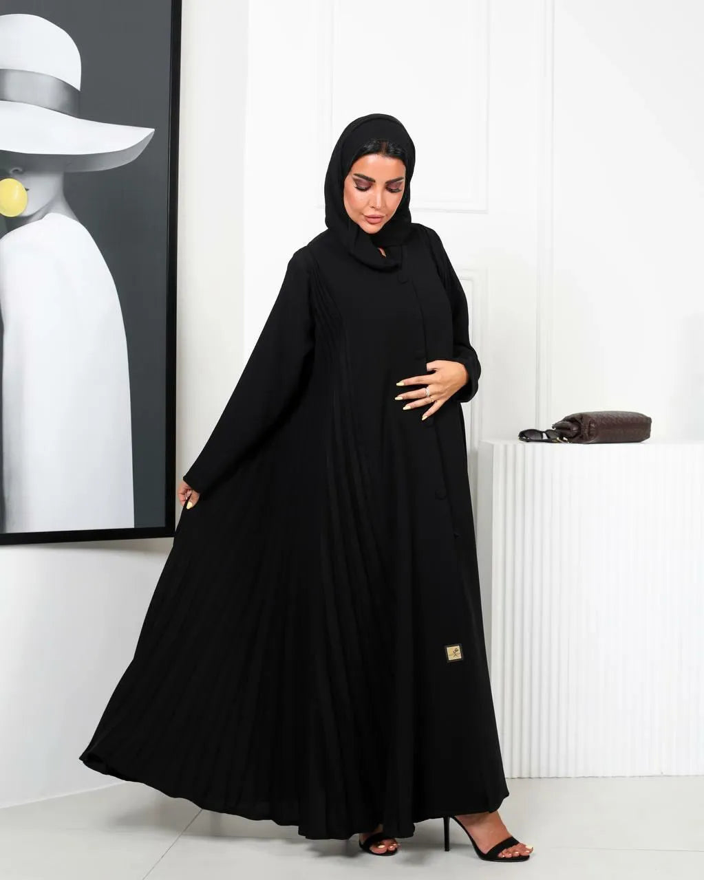 Black crepe abaya with a pleated and buttons on the front