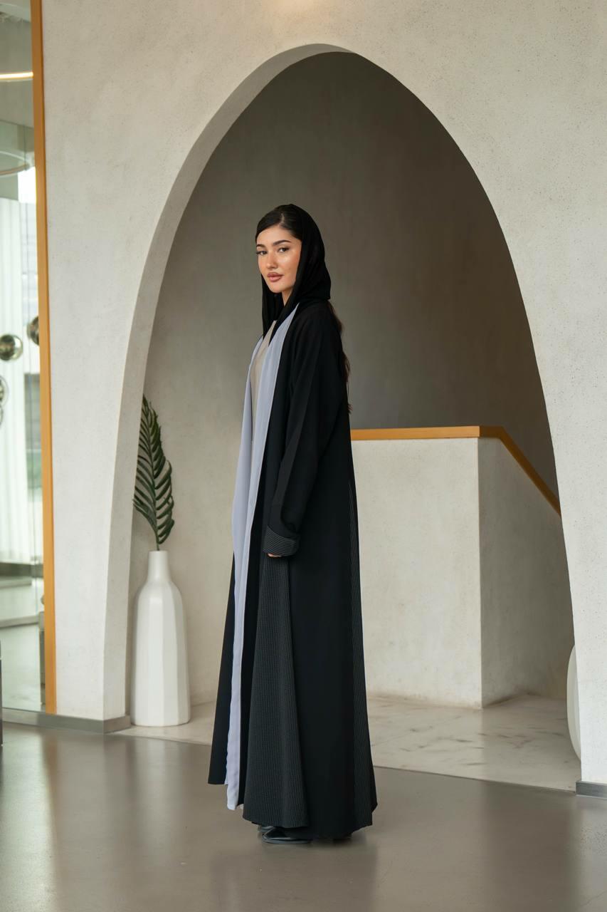 Practical black crepe abaya with striped trimming and lined with gray chiffon