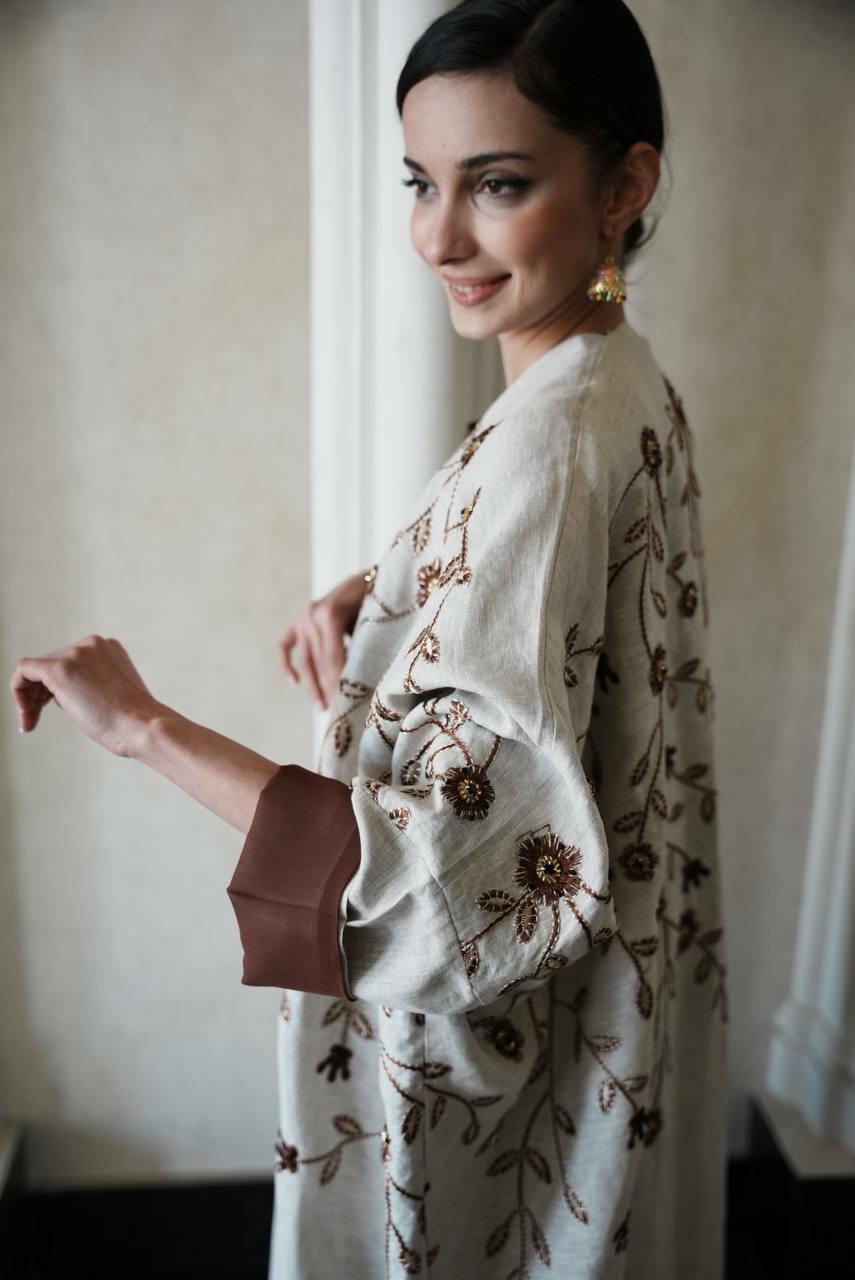 Beige linen bisht abaya with brown chiffon lining and elegant brown embroidery