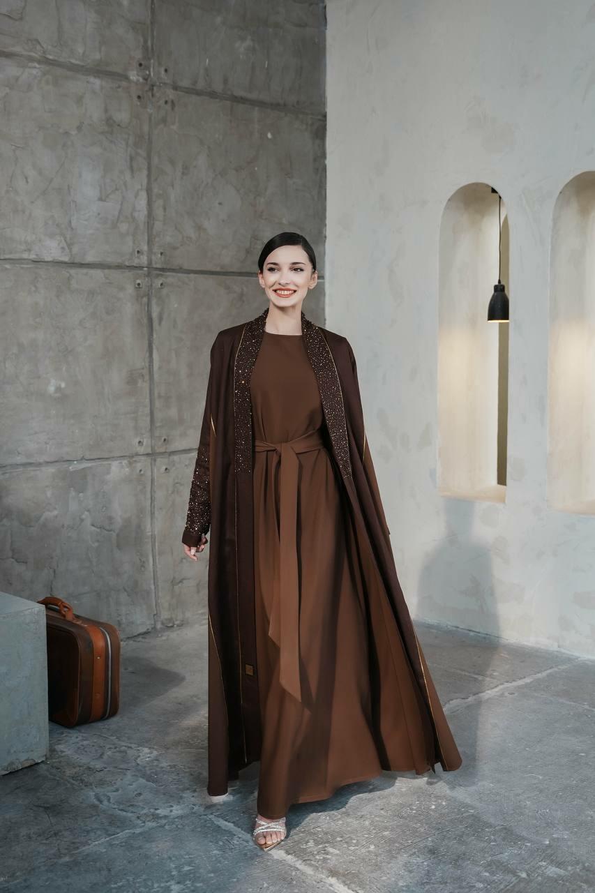 Dark brown linen abaya with the addition of light brown on the sides with luxurious hand embroidery
