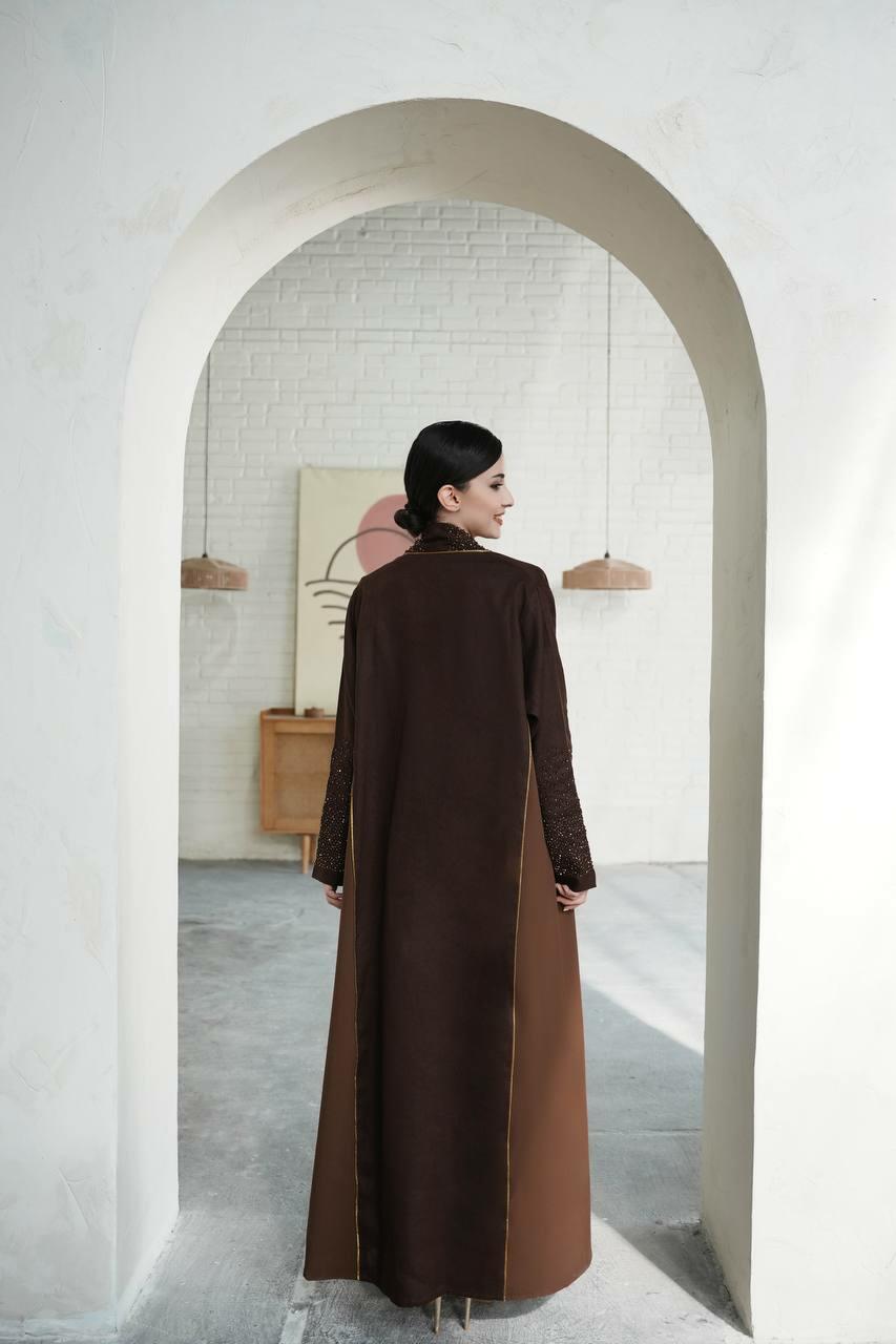 Dark brown linen abaya with the addition of light brown on the sides with luxurious hand embroidery