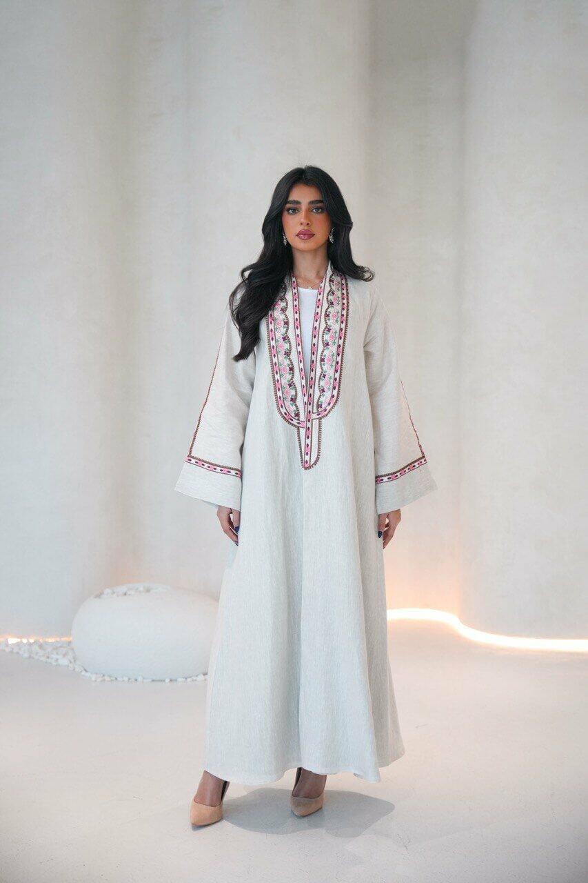 Beige linen abaya with a pistachio chiffon lining and pink,red embroidery