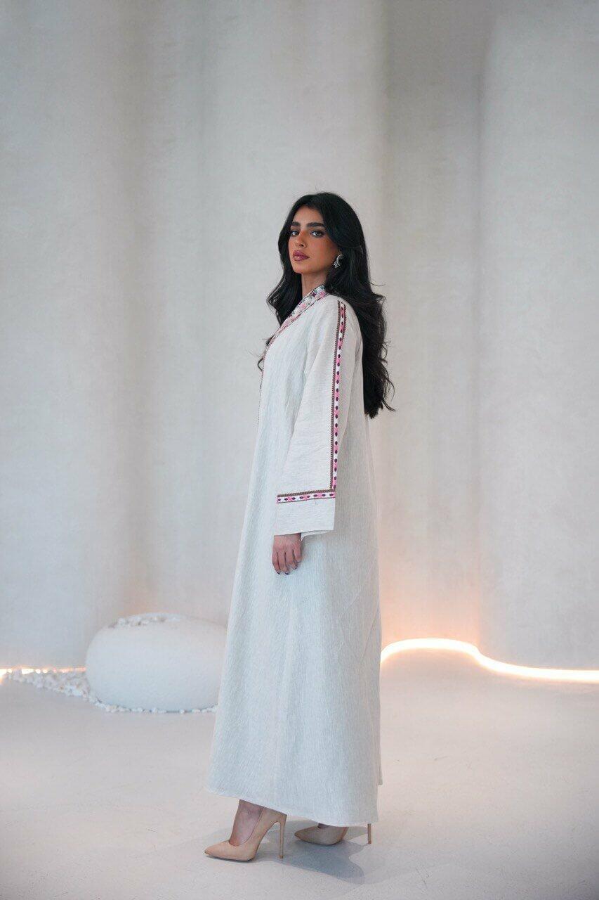 Beige linen abaya with a pistachio chiffon lining and pink,red embroidery