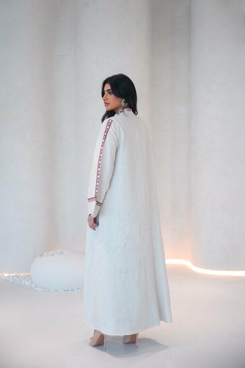 Beige linen abaya with a pistachio chiffon lining and pink,red embroidery