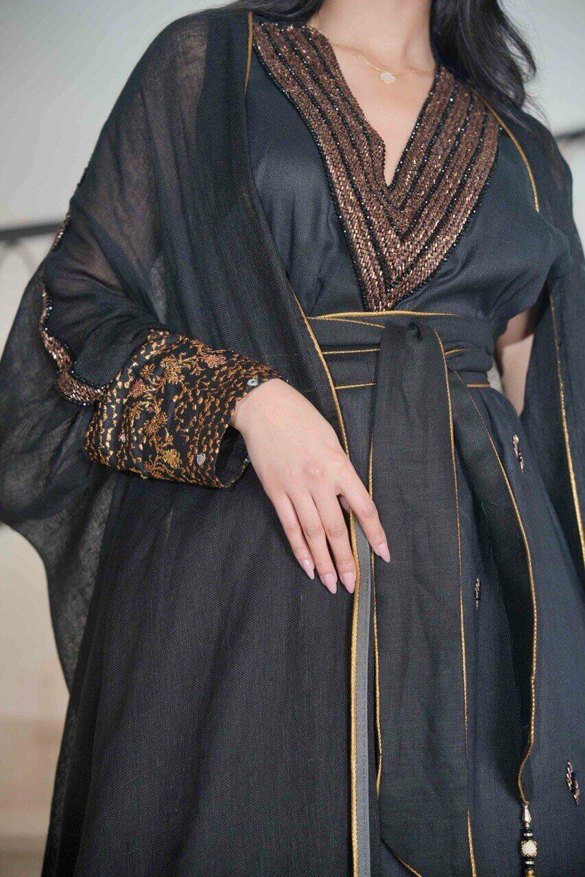 Black burlap bisht with black linen dress