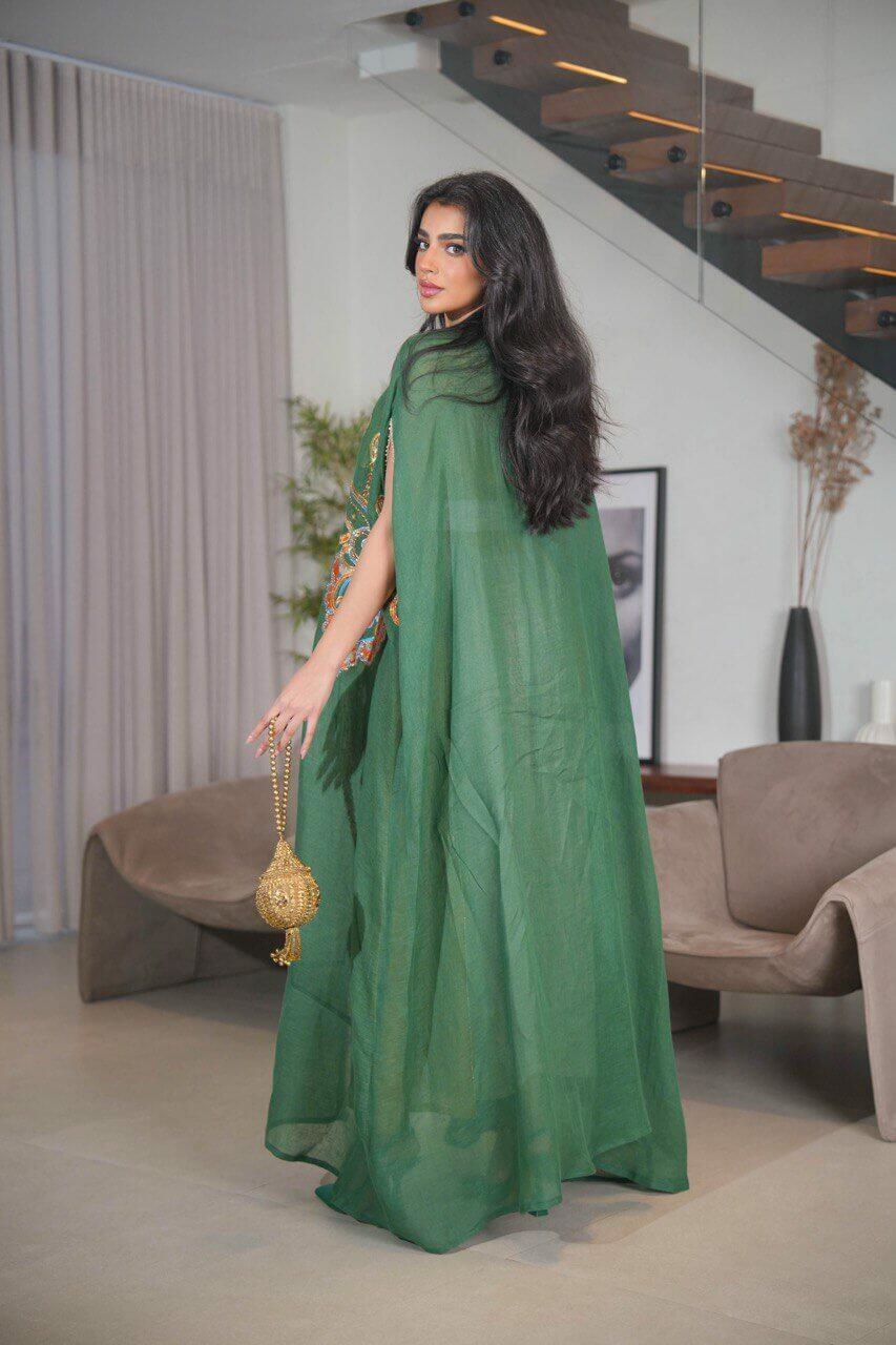 Green burlap bisht and a beige linen dress with orange