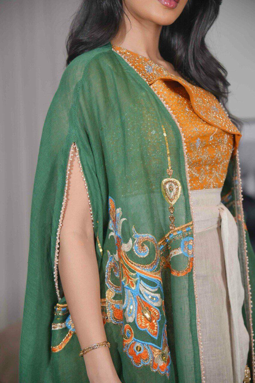 Green burlap bisht and a beige linen dress with orange