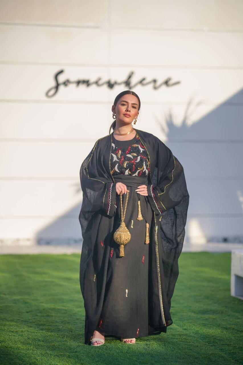 Black hessian bisht and black linen dress with a handmade sash