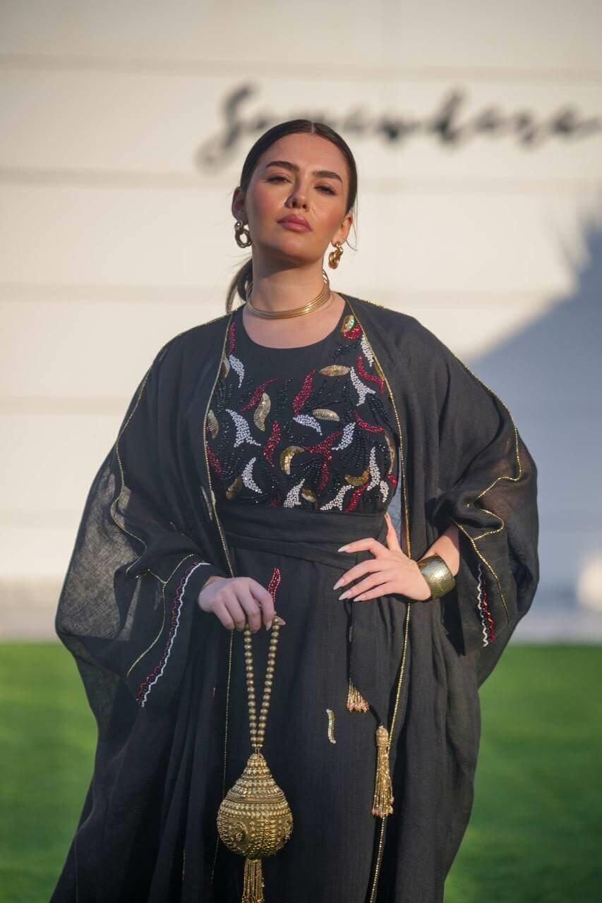 Black hessian bisht and black linen dress with a handmade sash