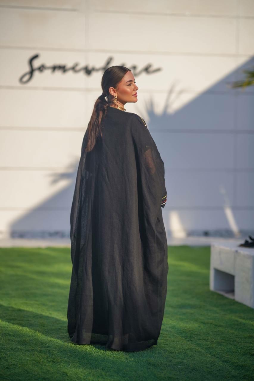 Black hessian bisht and black linen dress with a handmade sash