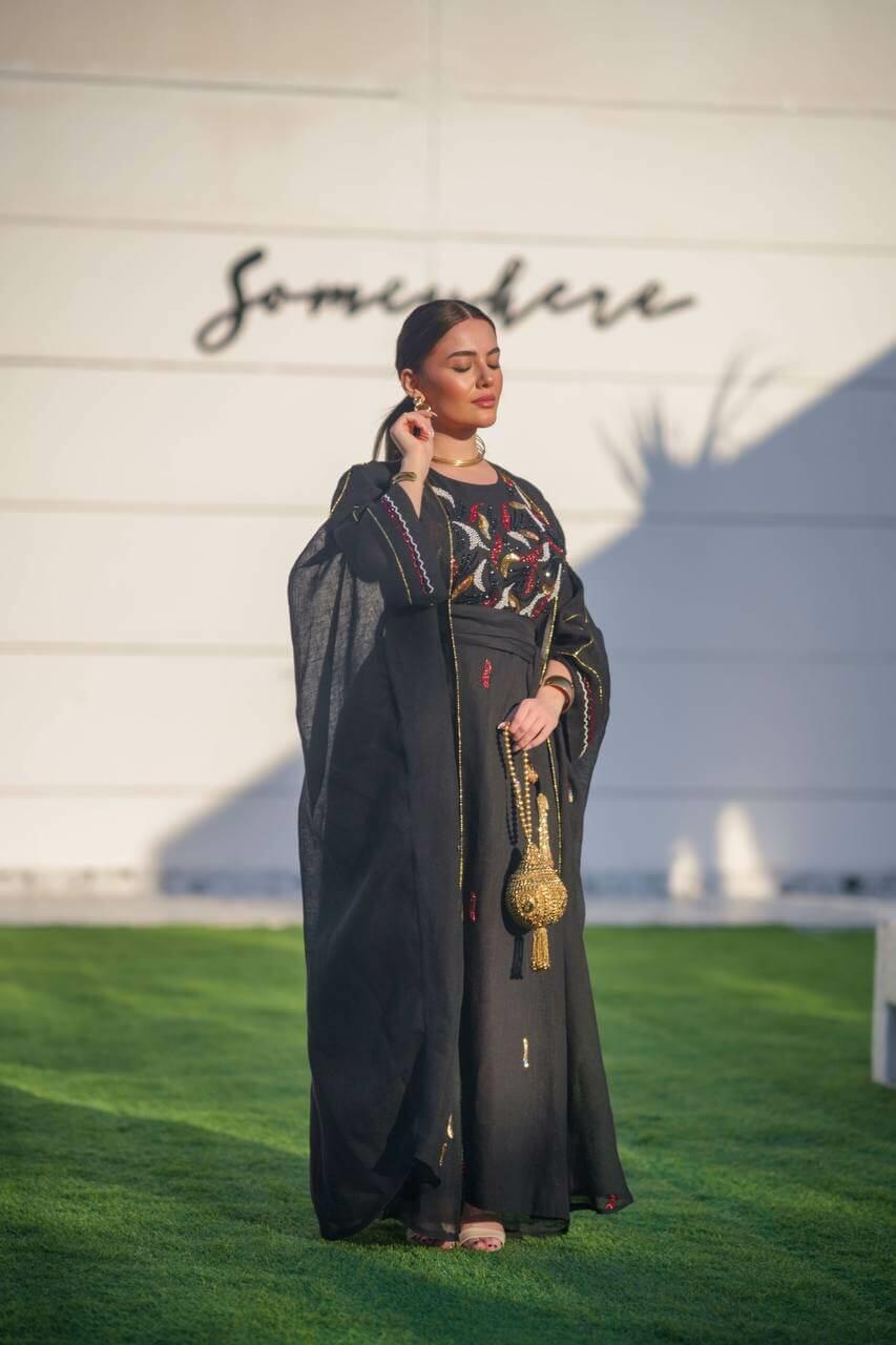 Black hessian bisht and black linen dress with a handmade sash