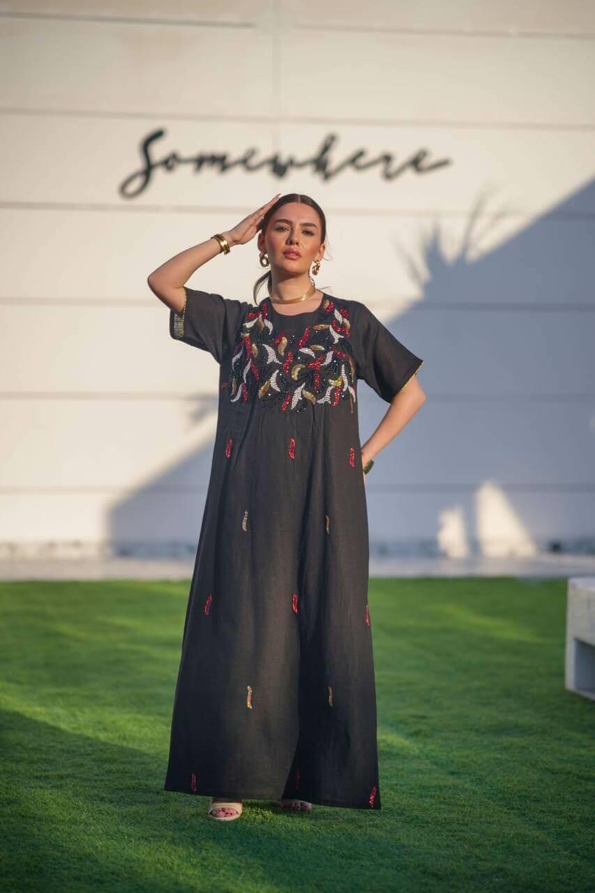 Black hessian bisht and black linen dress with a handmade sash
