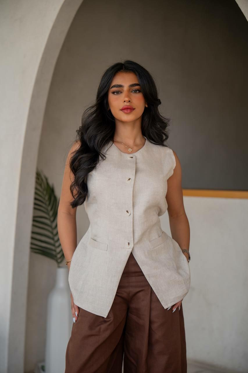 a practical set consisting of brown pants with a beige vest made of linen