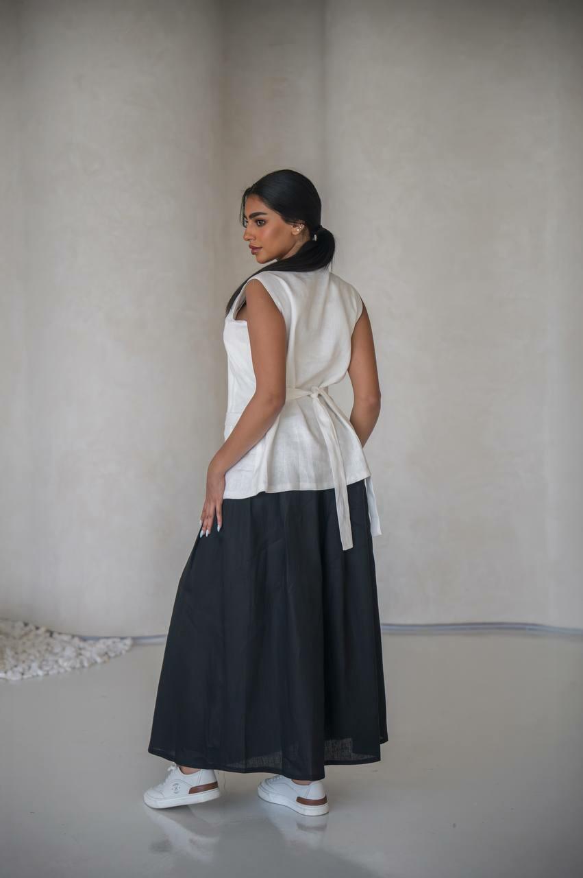 set consisting of a white vest with a black skirt made of premium linen