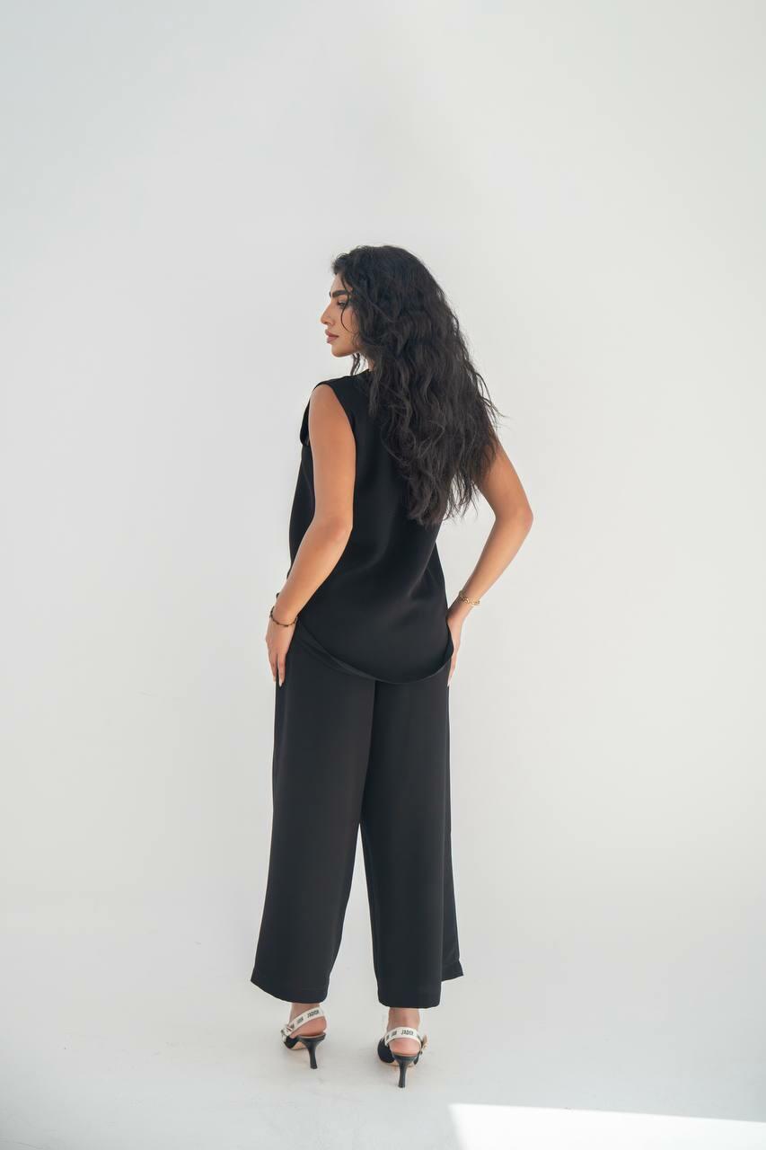 A blouse and pants set in black crepe