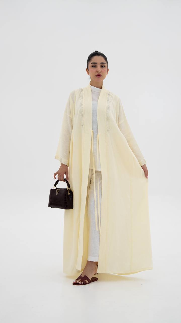 Yellow linen abaya with hand-stitched details (1919)
