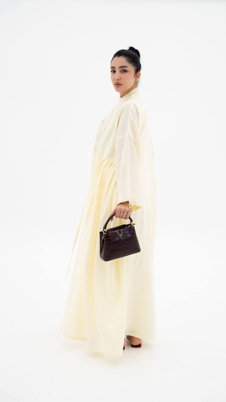 Yellow linen abaya with hand-stitched details (1919)