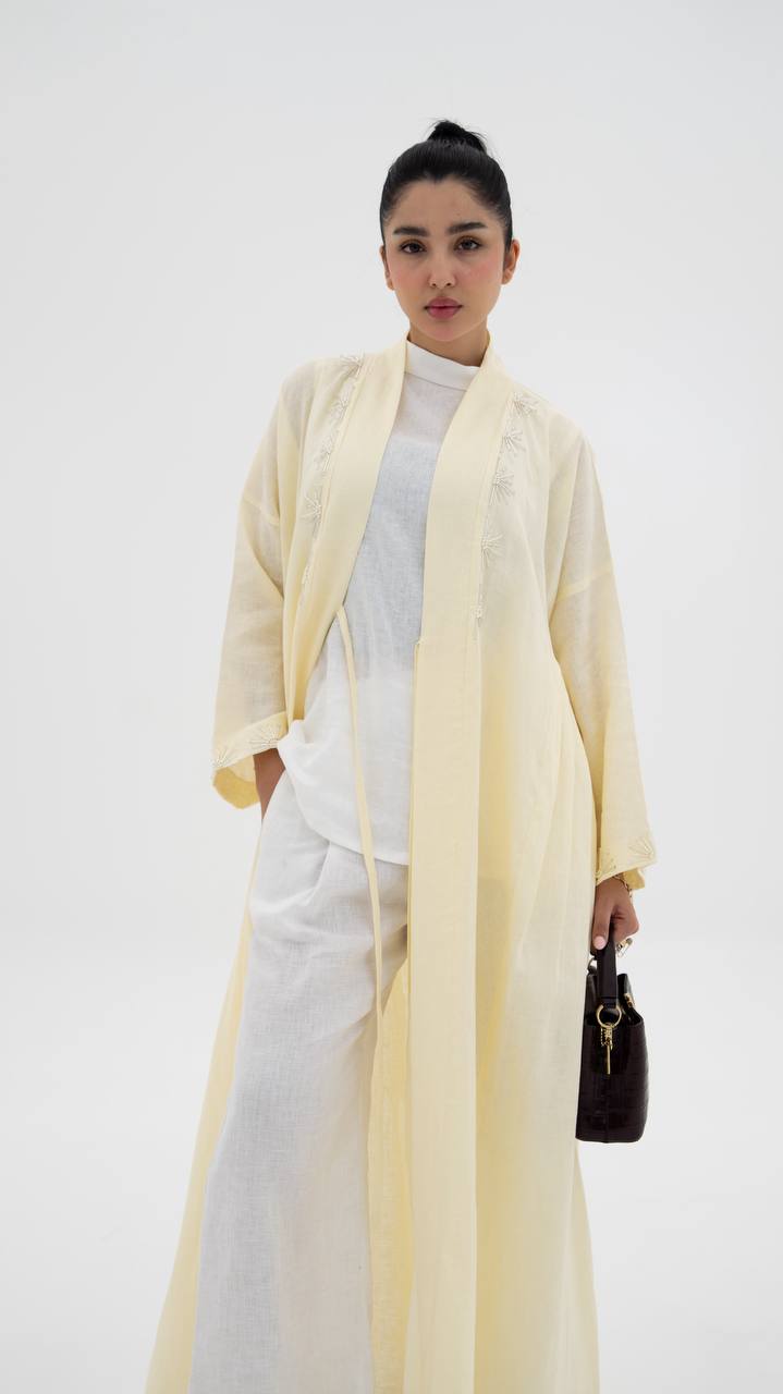 Yellow linen abaya with hand-stitched details (1919)