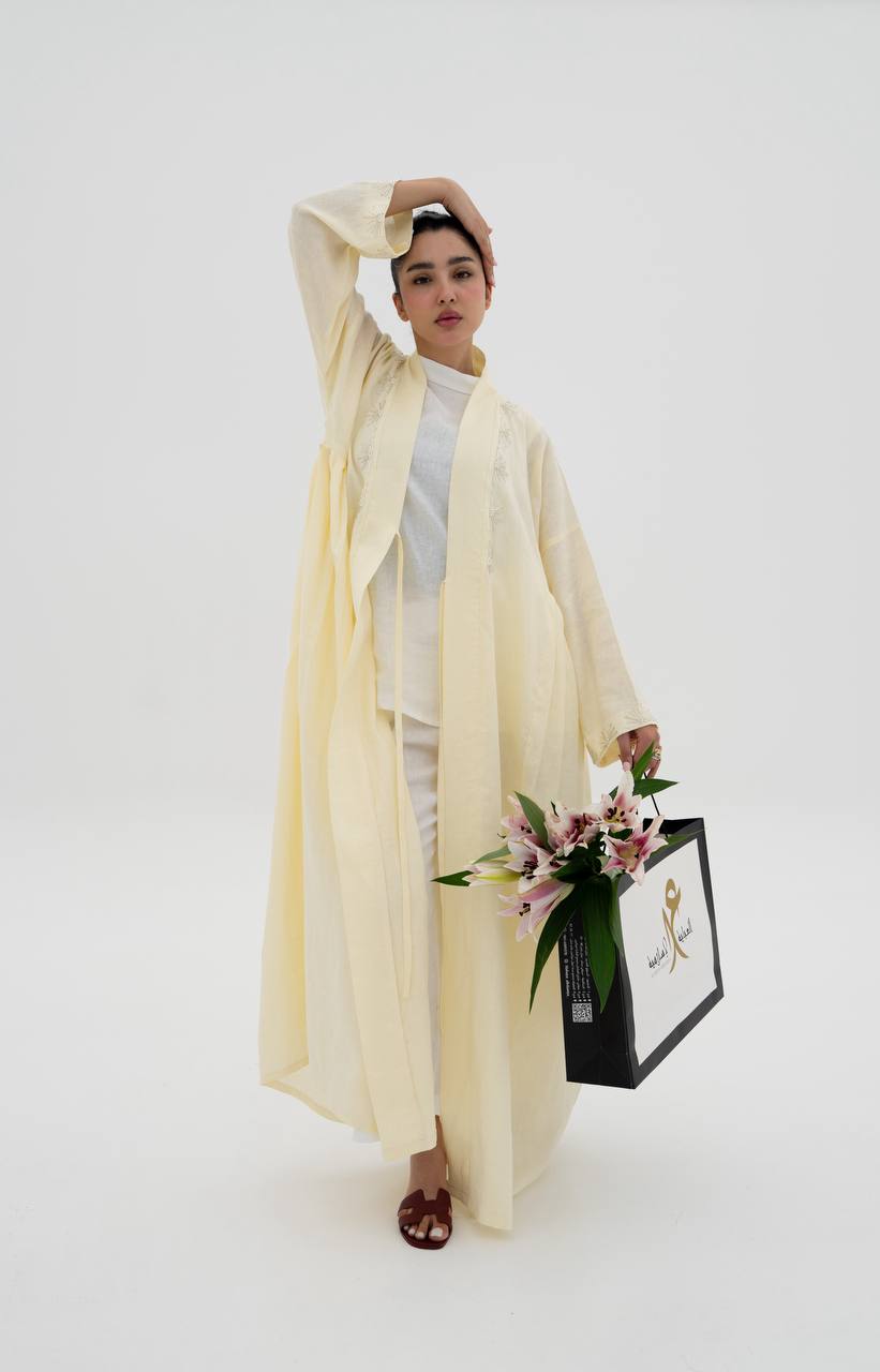 Yellow linen abaya with hand-stitched details (1919)