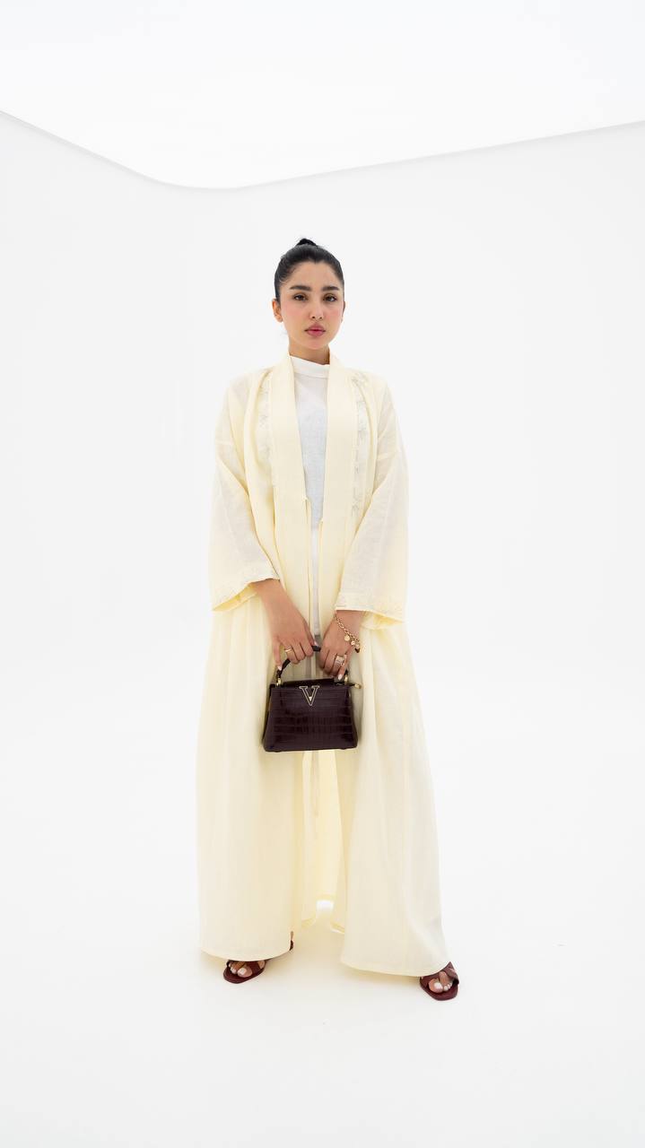 Yellow linen abaya with hand-stitched details (1919)