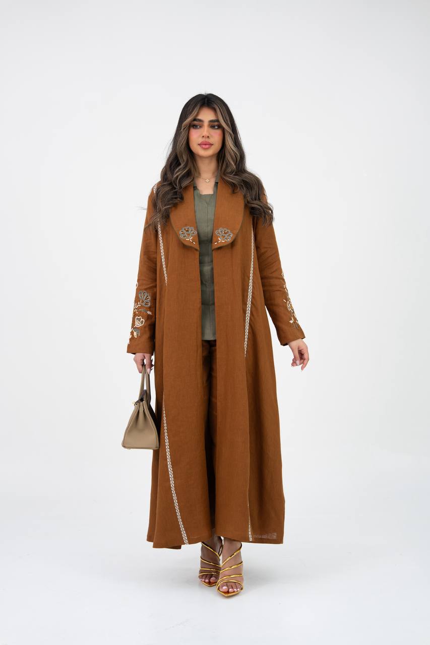 Camel-colored linen trench coat with hand embroidery and beadin