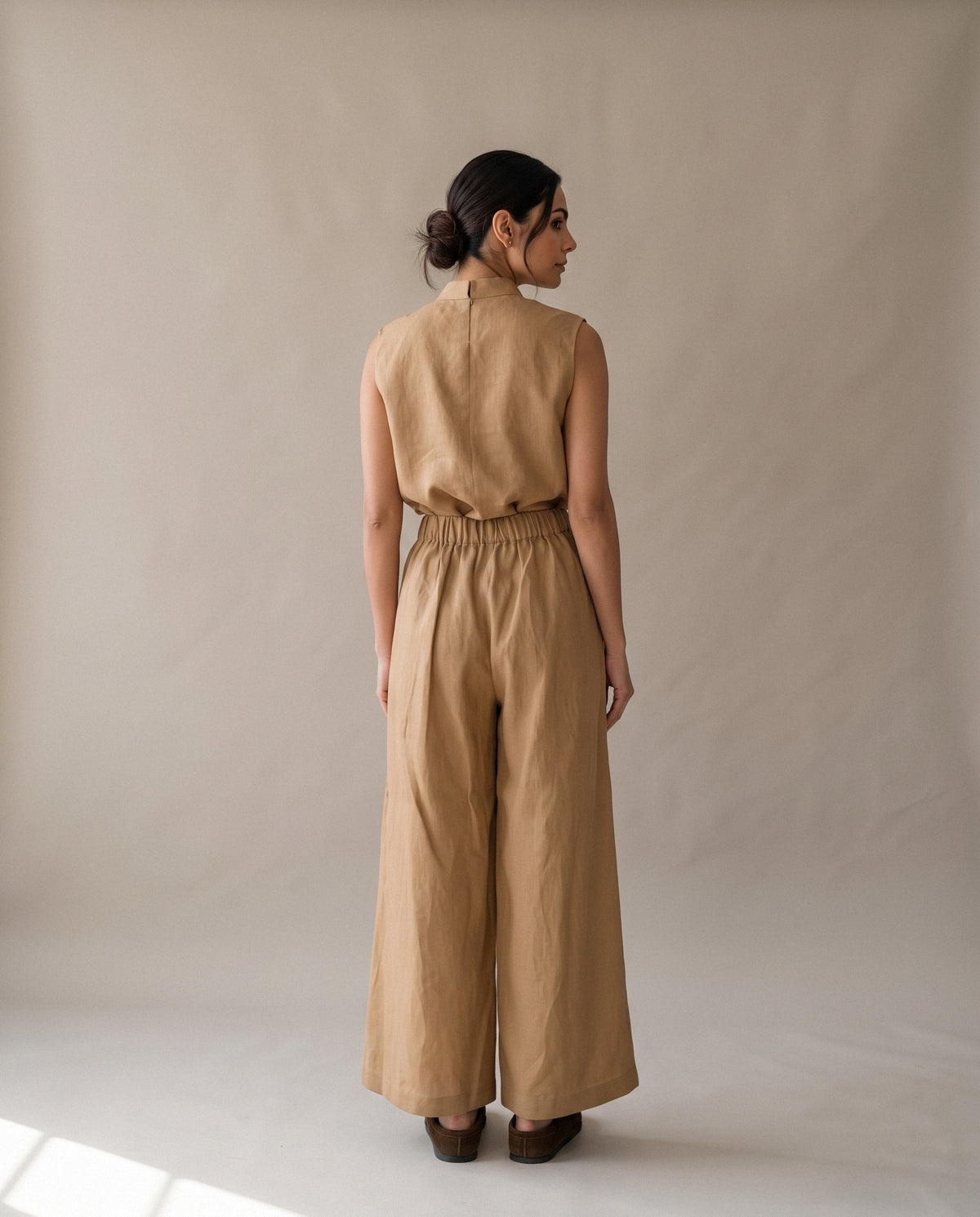 The Beige Linen Pants & Blouse Set from the back.