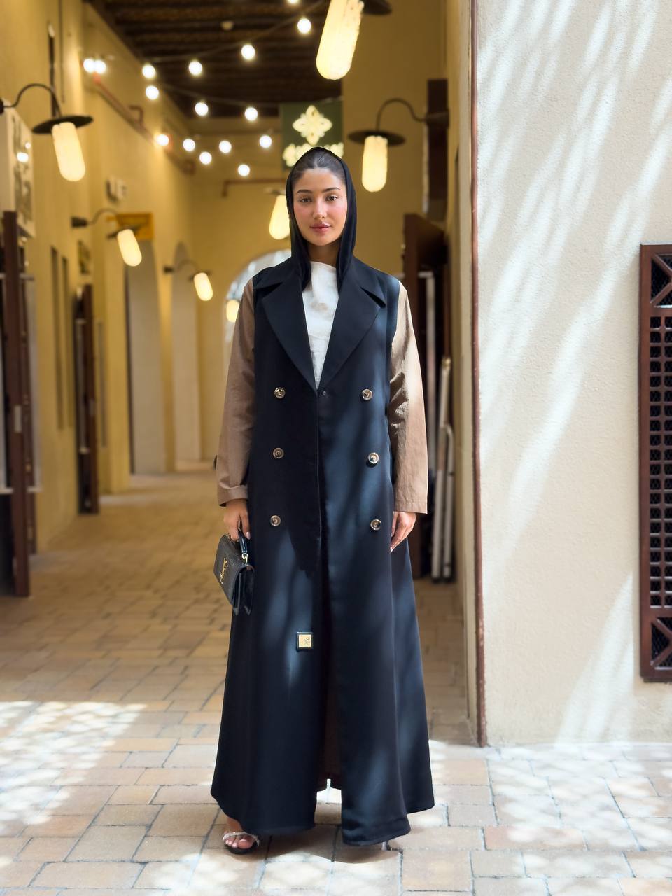 Black crepe blazer abaya in the front and a camel-colored trench coat in the back. C:6681