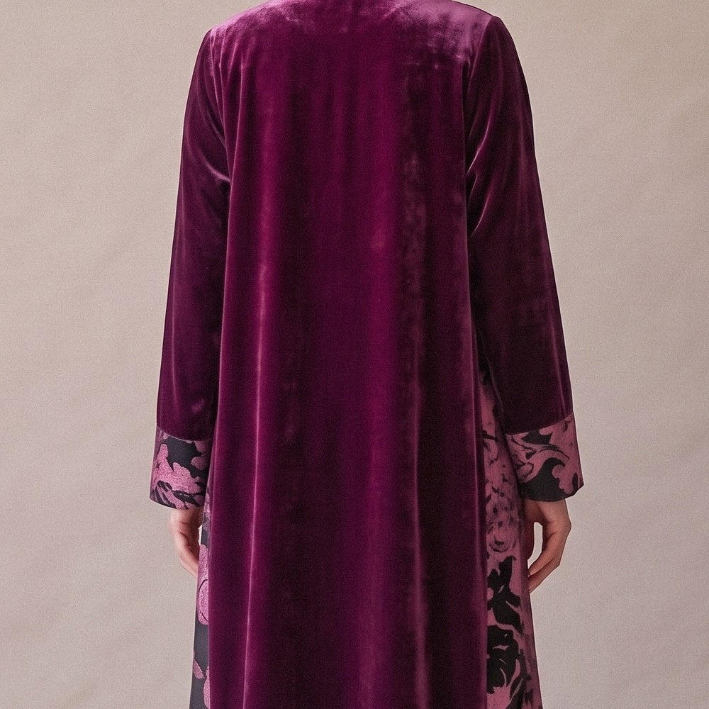 Close-up of the back of the Purple & Black Velvet Abaya: magenta velvet with a pink printed panel.